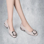 ZOFIA ATELIER beige PU leather square-toe flat shoes with decorative buckle detail.