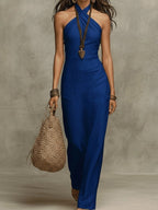 ZOFIA ATELIER blue linen blend halter cross V-neck maxi dress with a flowing silhouette.