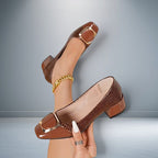 ZOFIA ATELIER dark brown synthetic leather square toe chunky heel slip-on shoes with gold buckle detail.