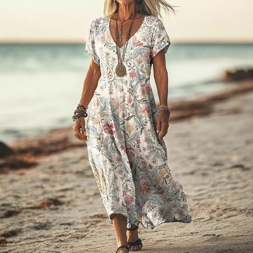 ZOFIA ATELIER GABRYSIA floral V-neck midi dress with short sleeves and a flowing silhouette, perfect for summer.