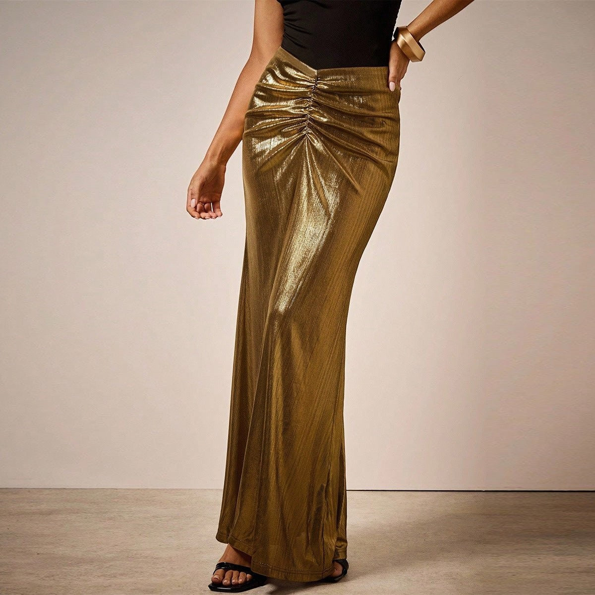 ZOFIA ATELIER gold metallic pleated long skirt with ruched detail and moderate stretch.