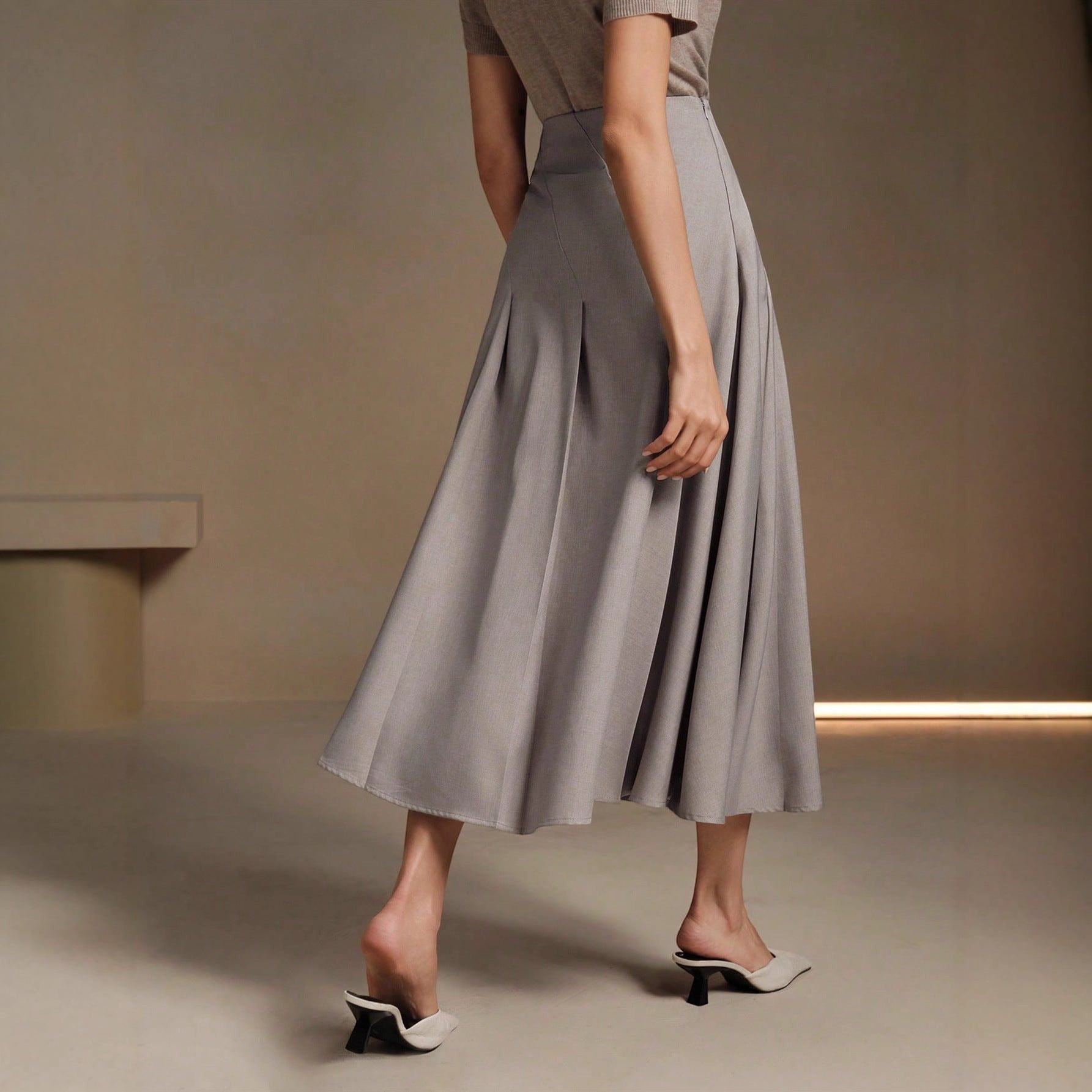 ZOFIA ATELIER gray polyester mid-length asymmetrical pleated skirt with a structured fit.