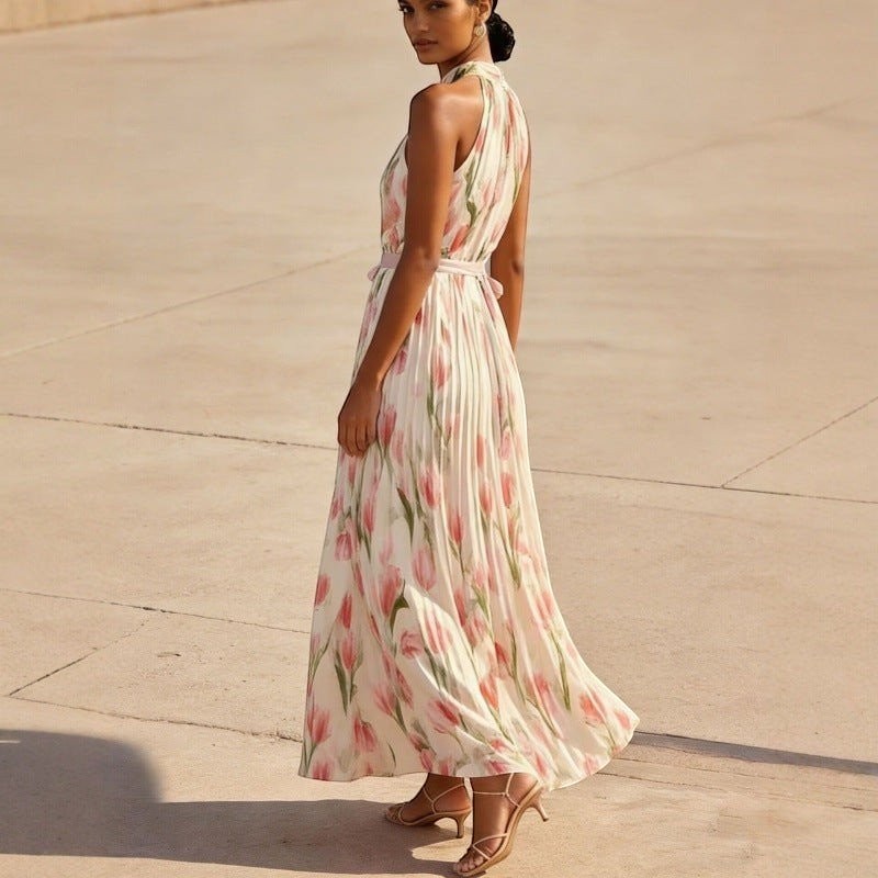ZOFIA ATELIER WIKTORIA halter swing maxi dress with pink floral print and pleated skirt.