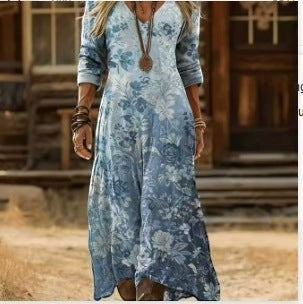 ZOFIA ATELIER JOLANTA watercolor boho maxi dress with blue floral print, V-neck, and long sleeves.