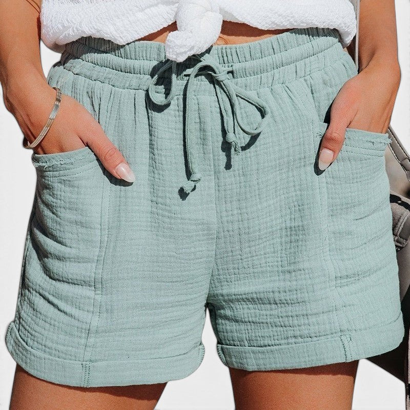 ZOFIA ATELIER light blue gauze belted wide-leg shorts with drawstring waist and cuffed hem.
