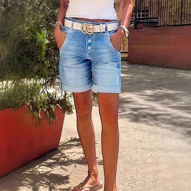 ZOFIA ATELIER RENATA high-waist denim crop shorts with button fly and rolled hem, light blue wash.