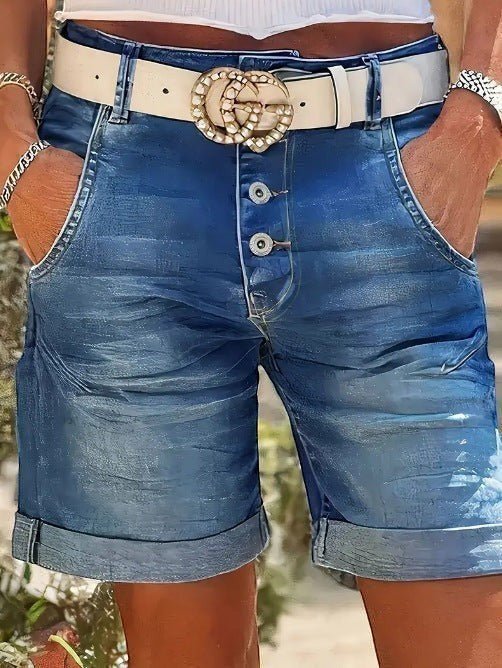 ZOFIA ATELIER RENATA high-waist denim crop shorts with rolled hem, button fly, and white belt with gold buckle.