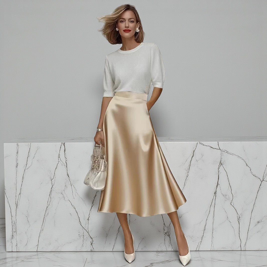 ZOFIA ATELIER satin midi skirt in champagne with a slight stretch fit and A-line silhouette.