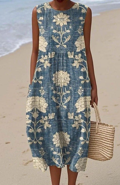 ZOFIA ATELIER sleeveless blue midi dress with cream floral print and pockets, made of flat mop cloth.