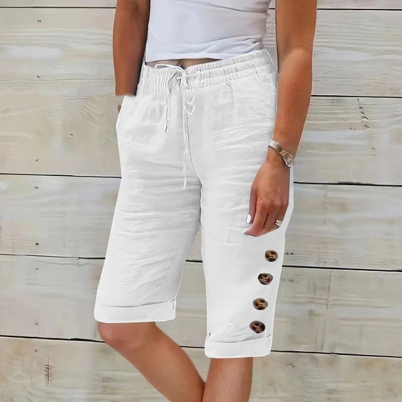 ZOFIA ATELIER white cotton linen blend wide leg capri pants with elastic waist and decorative buttons on the side.