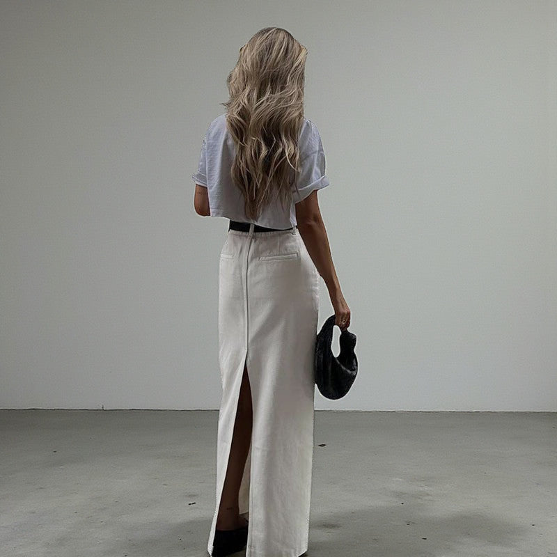 ZOFIA ATELIER white high-waist A-line maxi skirt with a back slit, made of spandex.