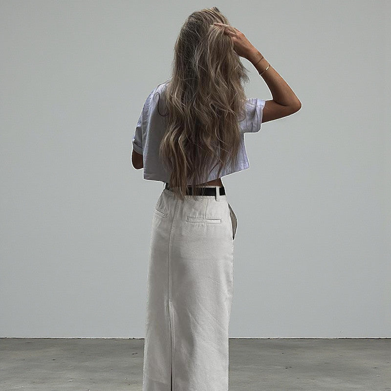 ZOFIA ATELIER white spandex casual slit skirt with high waist and A-line silhouette.